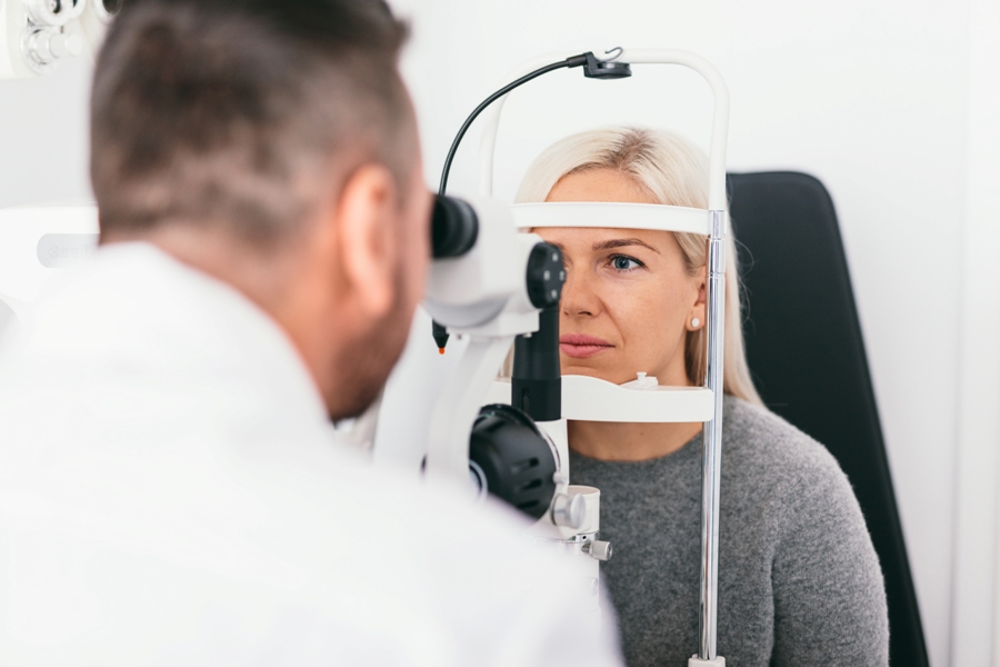 woman with subacute transverse myelitis getting eye exam