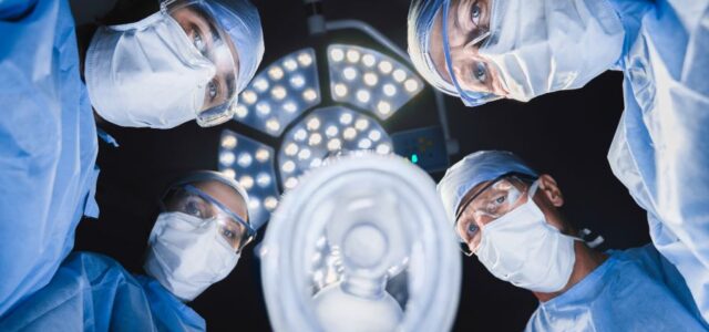 Doctors gives anesthetic medication to patient with Lyme disease.