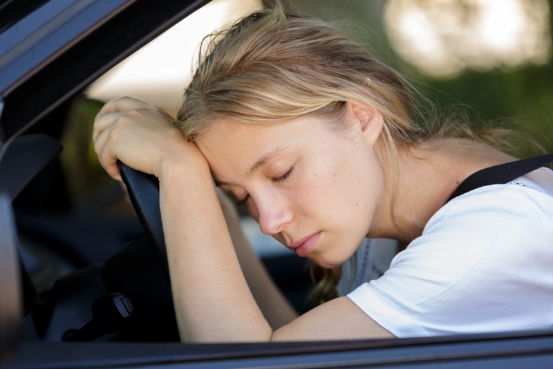 Woman sleeping in car who needs late stage lyme disease treatment