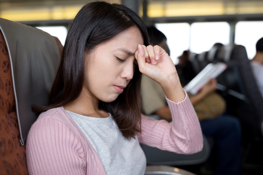 woman with lyme disease infection holding her head