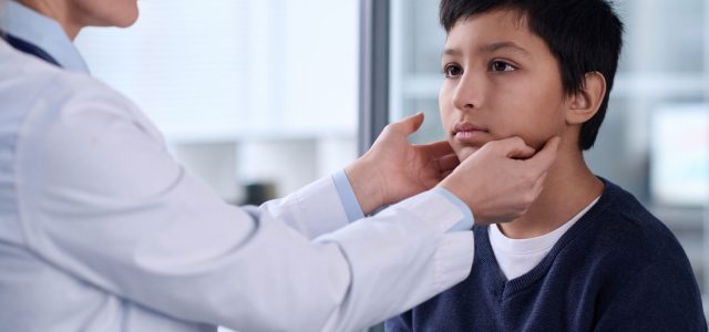 pediatric doctor evaluating facial weakness in child possible Lyme disease