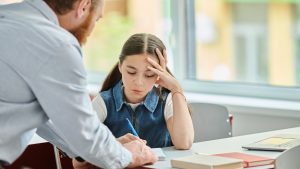 child struggling with schoolwork due to Lyme disease brain fog and fatigue