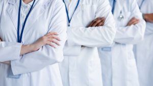 Doctors from different specialties representing the challenge of coordinating care in complex Lyme disease
