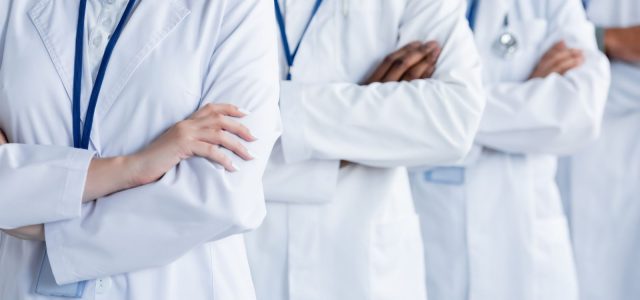 Doctors from different specialties representing the challenge of coordinating care in complex Lyme disease