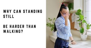 Woman feeling unwell while standing and using a desk for support
