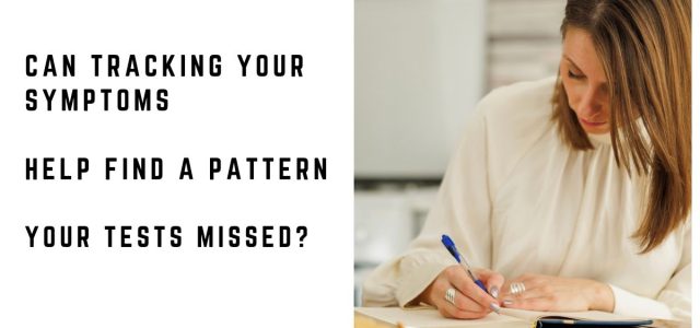 Woman writing in a notebook at home to keep track of her symptoms