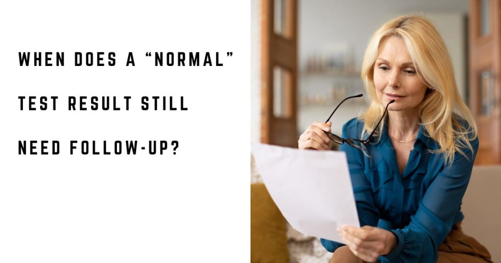 Woman reviewing medical test results at home after receiving a normal result