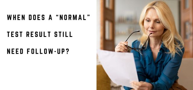 Woman reviewing medical test results at home after receiving a normal result